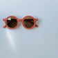 Kids round shaped sunglasses in colour coral