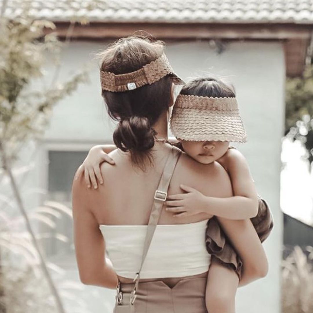 mother and child wearing matching palm visor brown fini the label summer resort