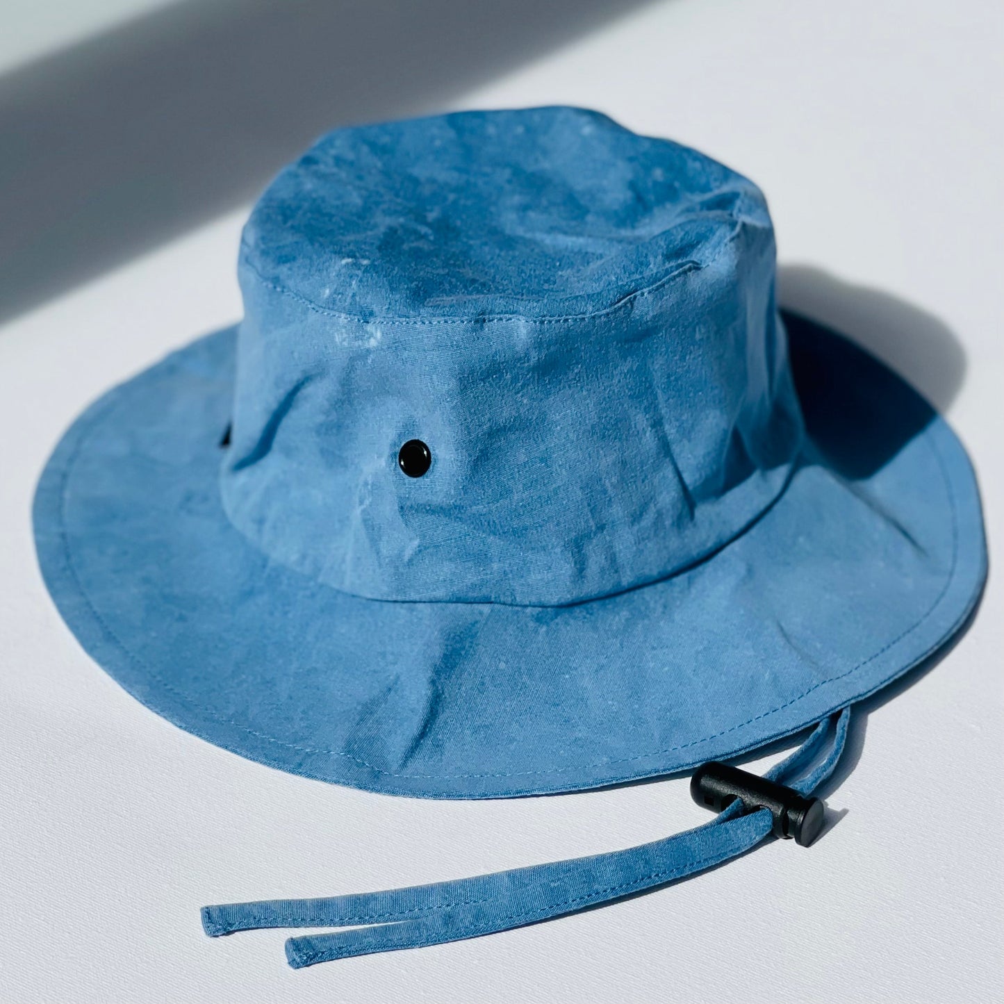 WS_available now_FINI. HAT: fini. relaxed bucket hat - denim-fini. the label