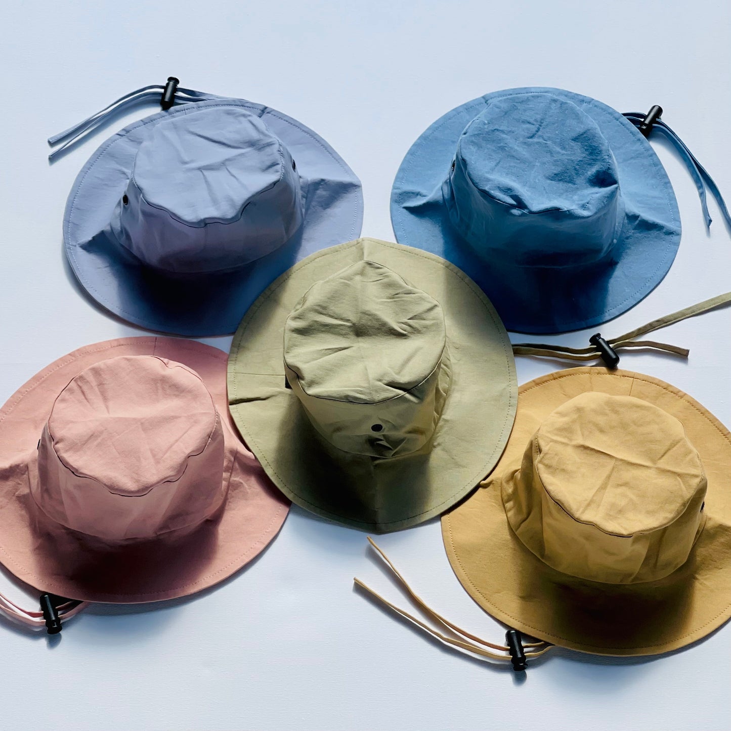 WS_available now_FINI. HAT: fini. relaxed bucket hat - gold-fini. the label