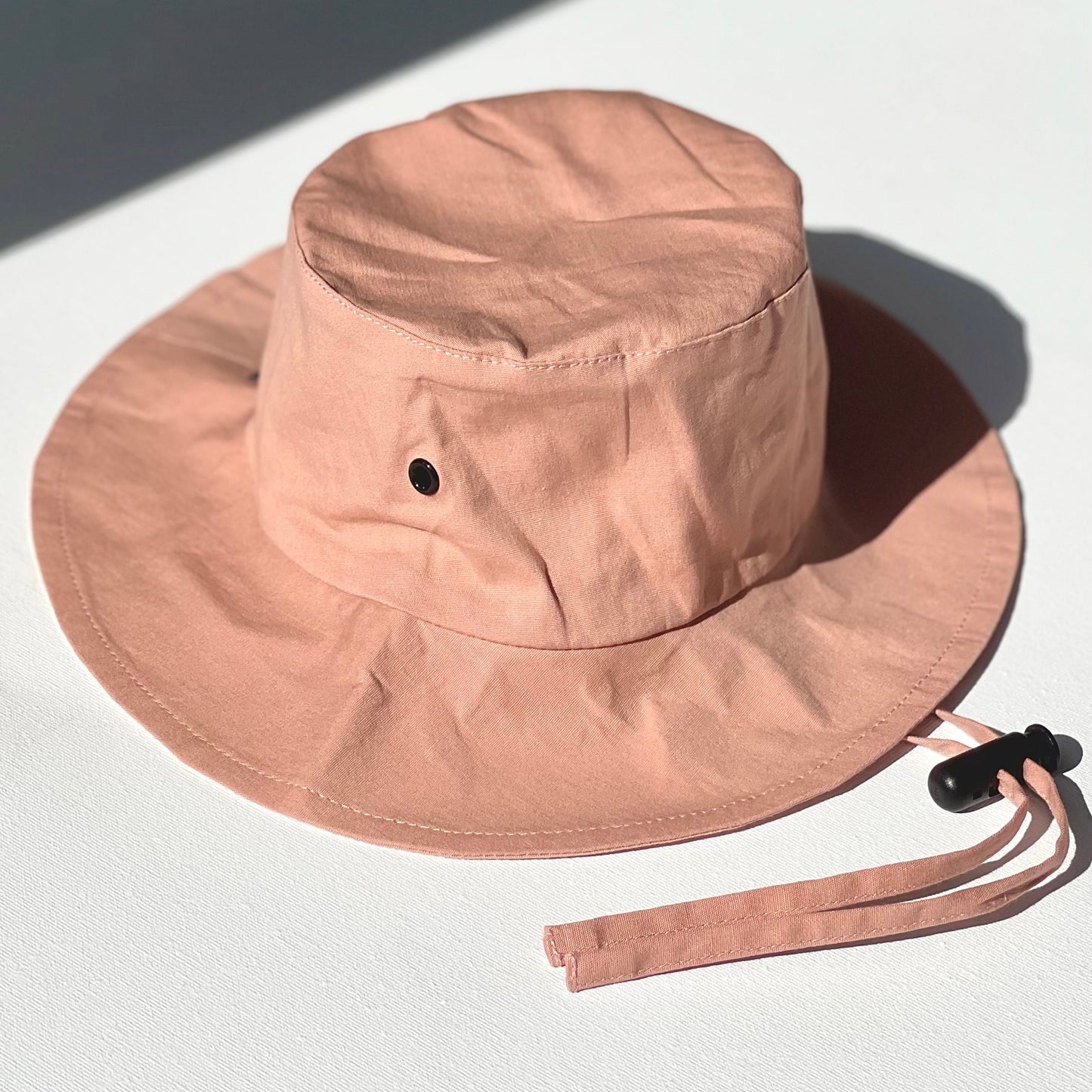 WS_available now_FINI. HAT: fini. relaxed bucket hat - pink-fini. the label