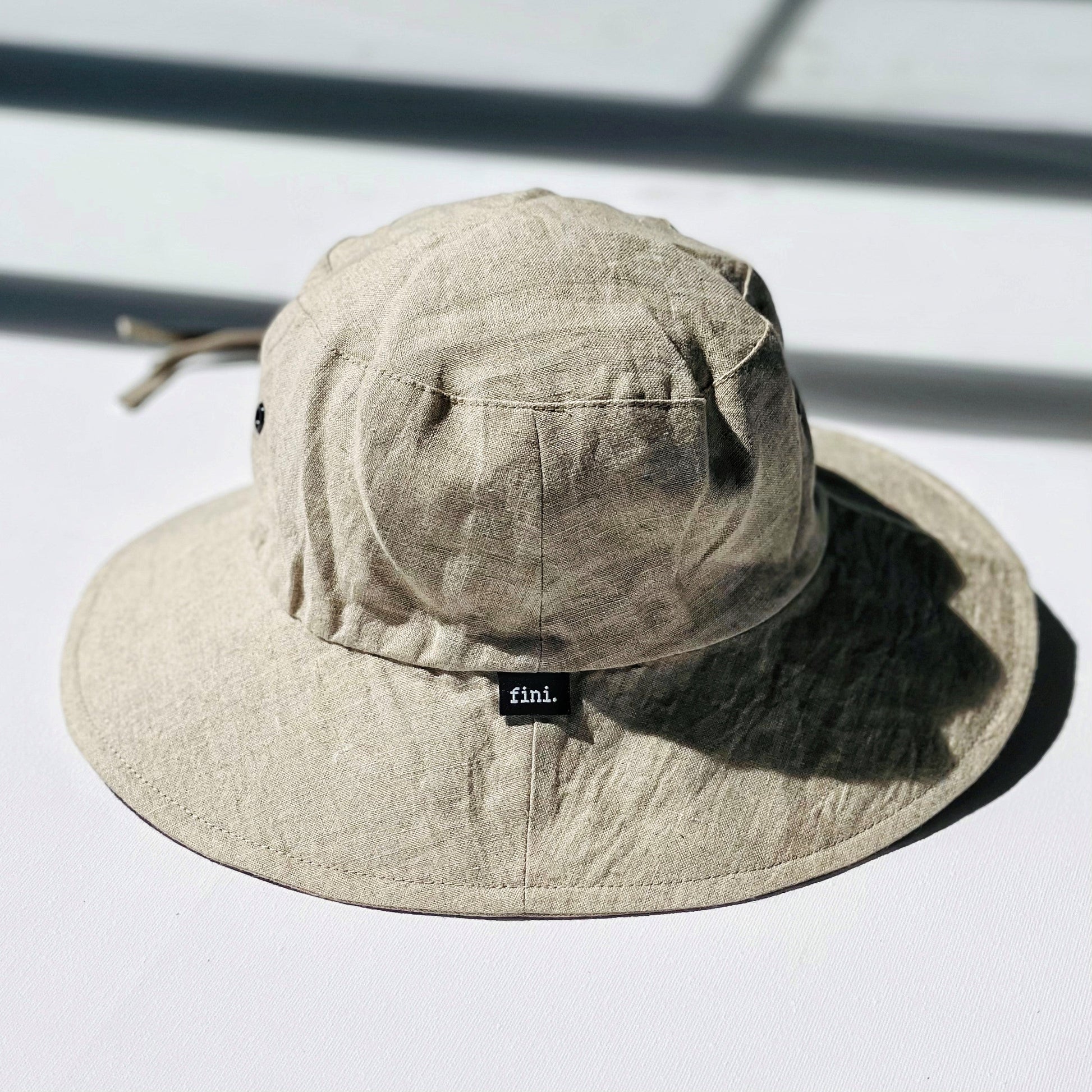 WS_available now_FINI. HAT : fini. relaxed bucket hat - linen-fini. the label