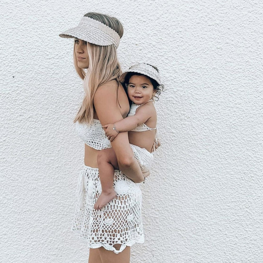 mother and daughter wearing fini. palm visor light beige matching set